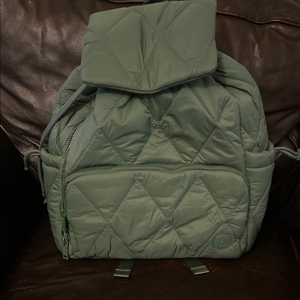 Bookish goods brand green quilted backpack